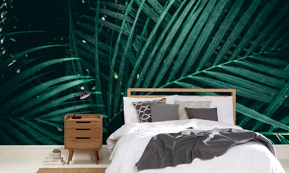 Minimalist style bedroom with green palm leaves wallpaper 