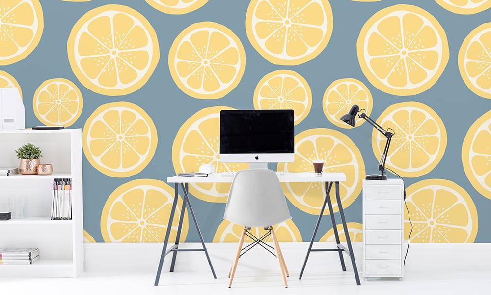 Large scale lemon wallpaper with stone blue background in office setting