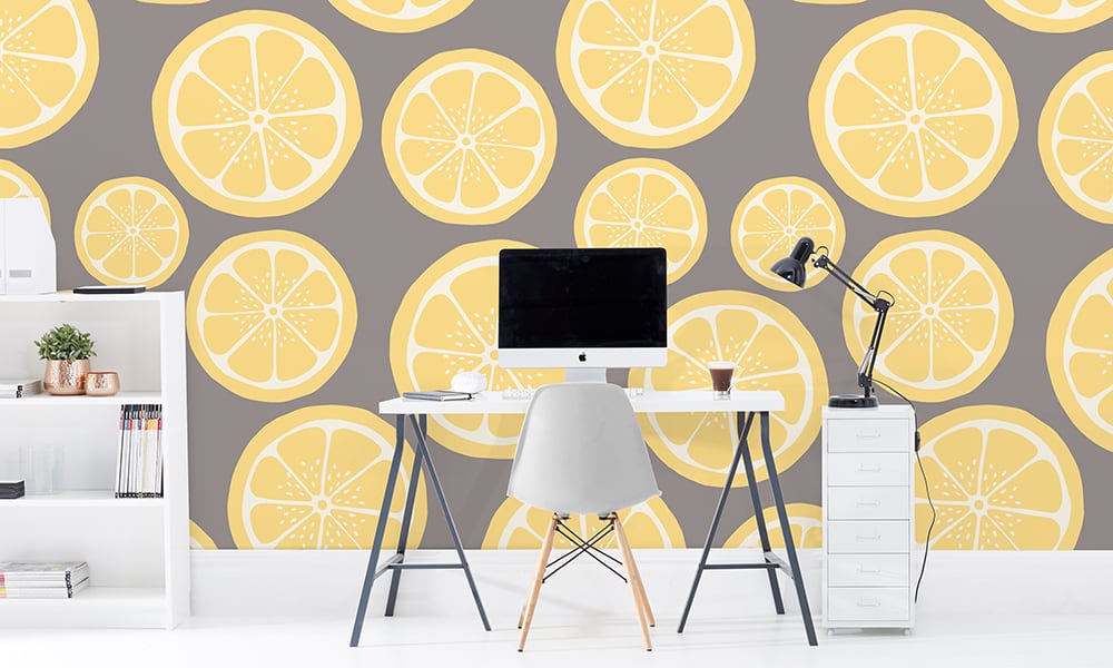 Large scale lemon wallpaper with stone grey background in office setting