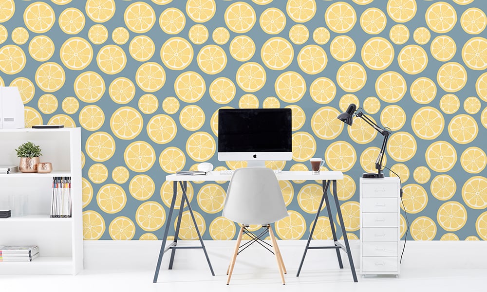 Medium scale lemon wallpaper with stone blue background in office setting