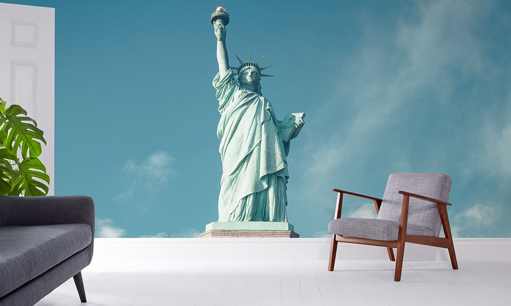 Modern living room with grey chair and new york wallpaper with statue of liberty
