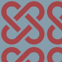 Red linked patterned wallpaper on blue background with chair and picture frame