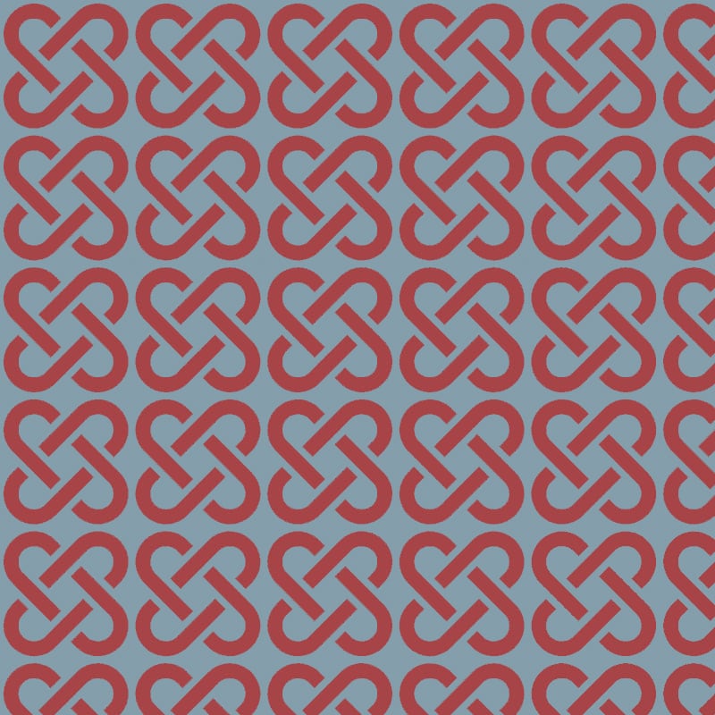 Red linked patterned wallpaper on blue background with chair and picture frame