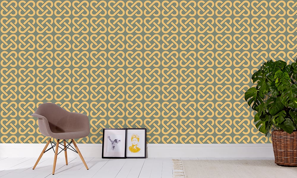 Medium scale mustard linked wallpaper pattern with grey chair and frame