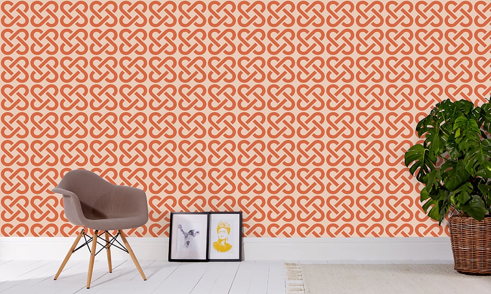 Medium scale linked wallpaper in orange with grey chair and frame