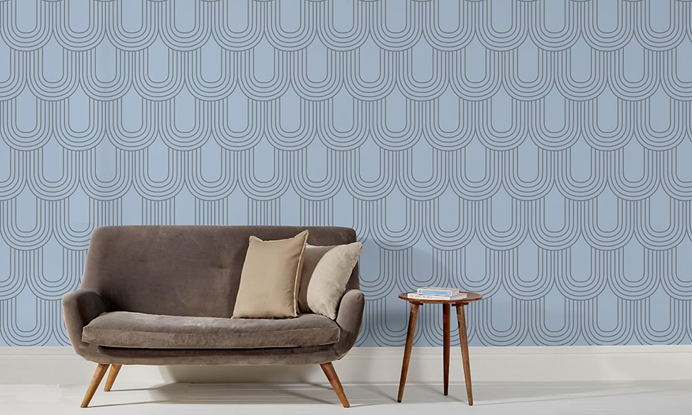 Retro arch-shaped wallpaper pattern in blue colours in a mid-century modern living room 