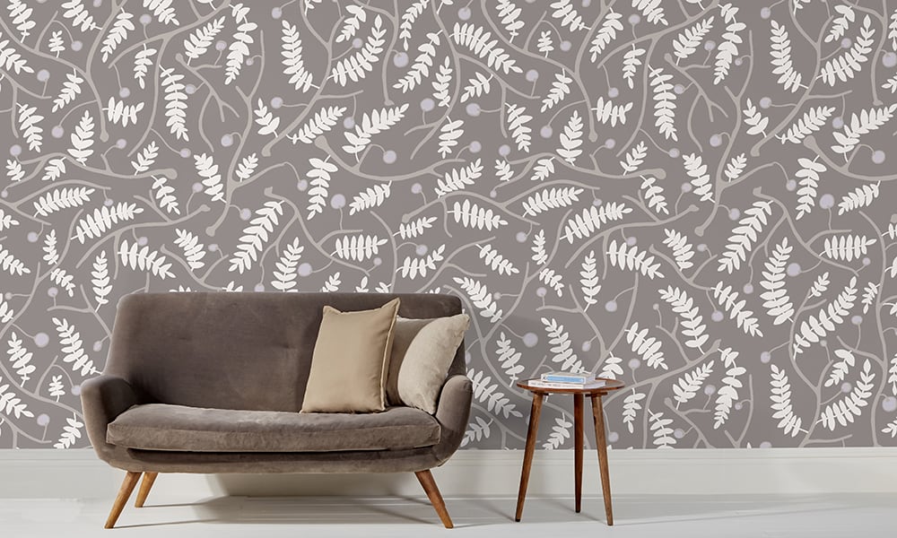 Grey wallpaper in a large scale situated in living room with grey sofa 