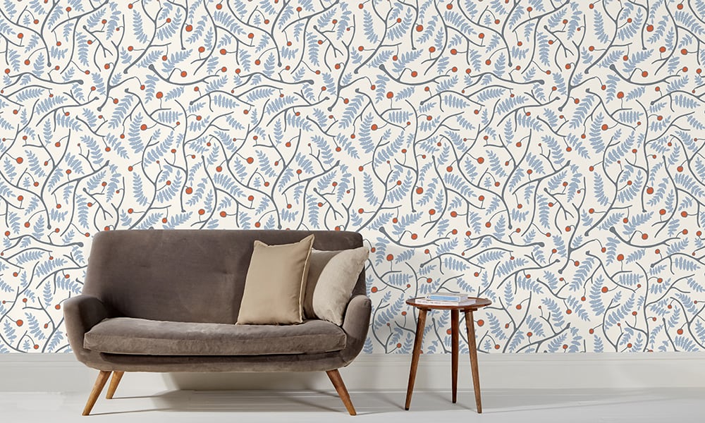 Cool blue wallpaper in a medium scale situated in living room with grey sofa 