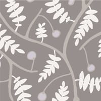 Grey leafy wallpaper in living room setting with grey sofa and side table