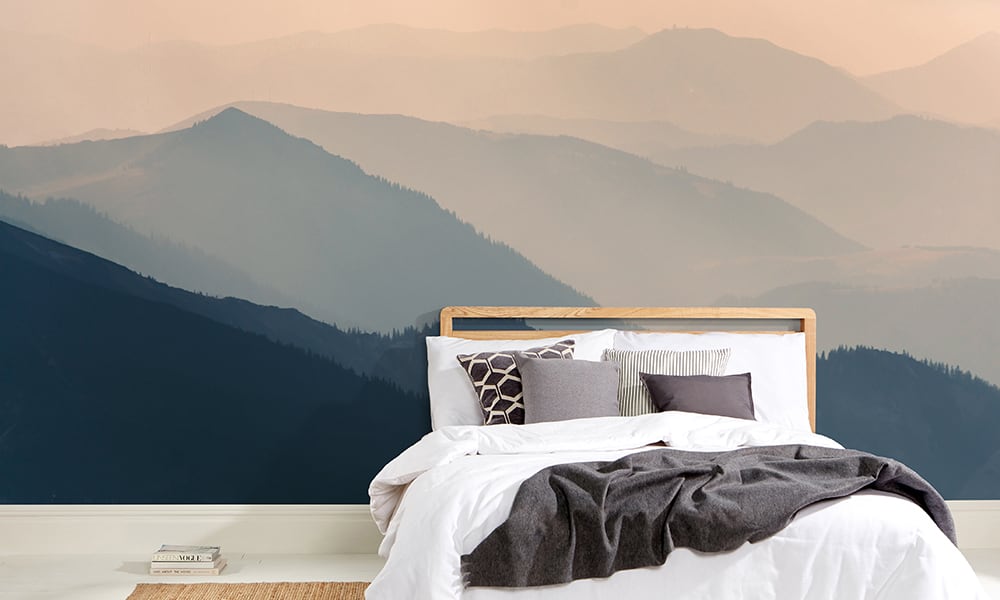 Scnadi bedroom with mountain wallpaper mural in green and pink