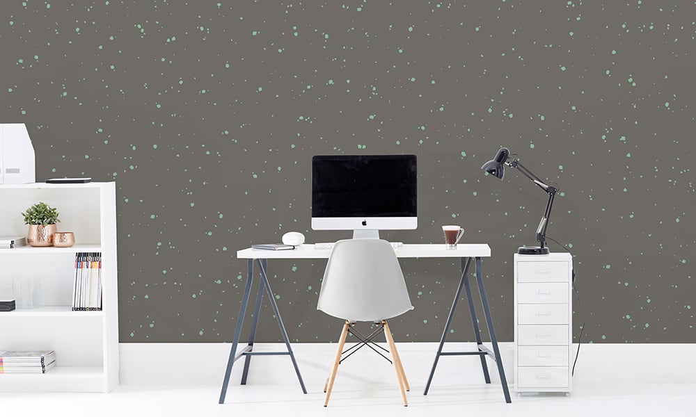 Large scale noise wallpaper pattern in grey in office setting with desk