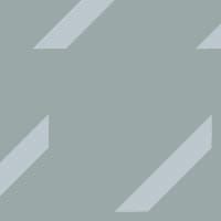Oblique repeat pattern wallpaper in blue duck-egg in living room setting with plant and grey sofa