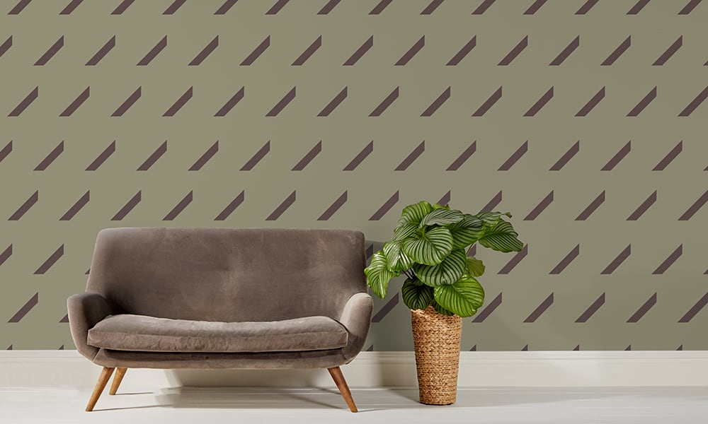 Medium scale green repeat pattern wallpaper with grey sofa and plant