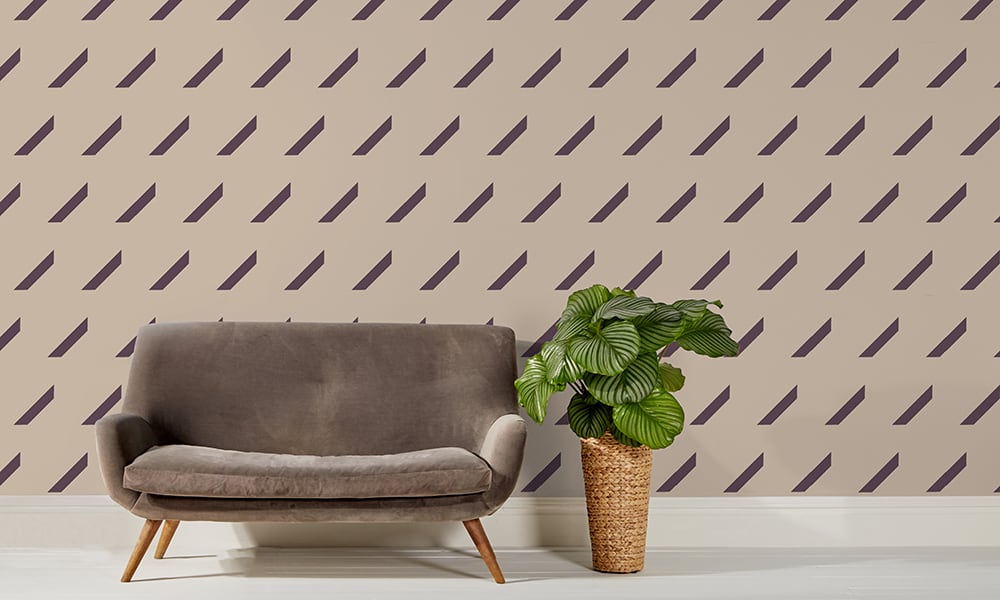 Medium scale mocha repeat pattern wallpaper with grey sofa and plant