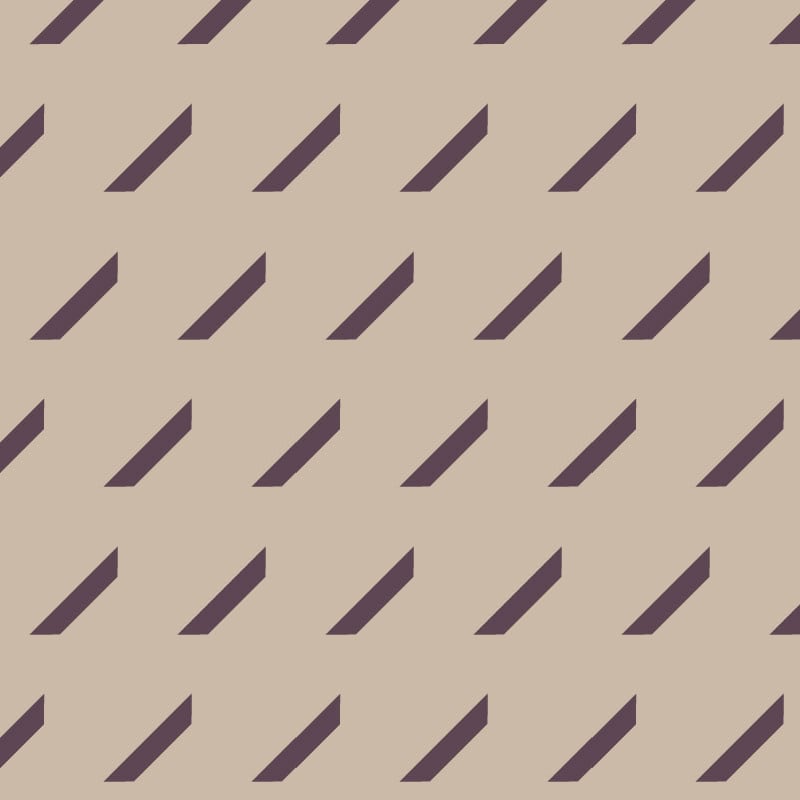 Oblique repeat pattern wallpaper in mocha in living room setting with plant and grey sofa
