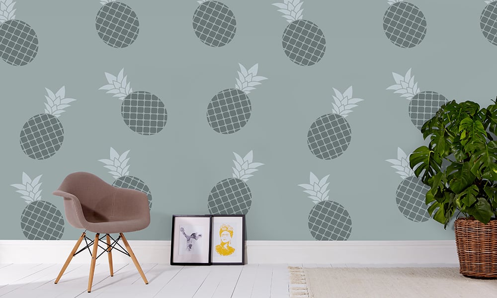 Blue pineapple wallpaper in large scale with grey chair and frame