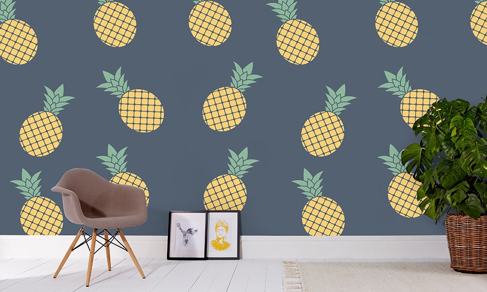 Pineapple wallpaper in large scale with grey chair and frame