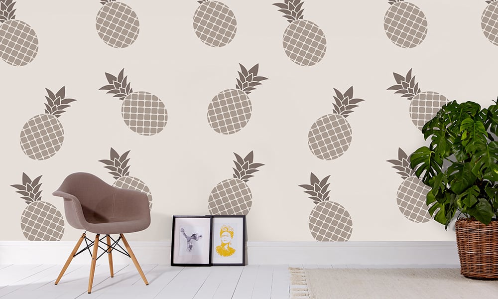 Grey pineapple wallpaper in large scale with grey chair and frame