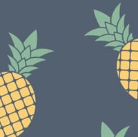 Pineapple wallpaper design with grey chair and picture frame