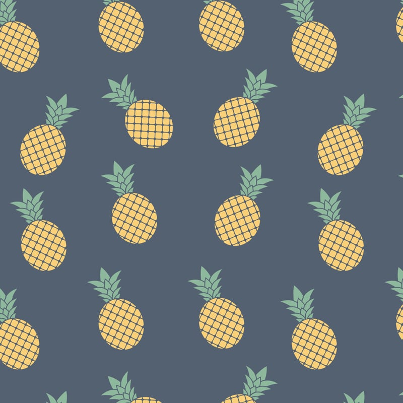Pineapple wallpaper design with grey chair and picture frame