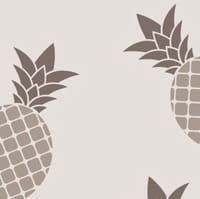 Pineapple wallpaper design in grey with grey chair and picture frame