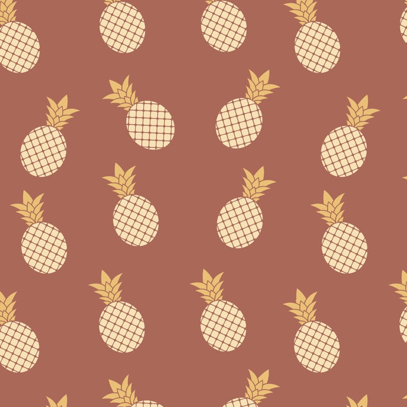 Pineapple wallpaper design in jupiter red with grey chair and picture frame