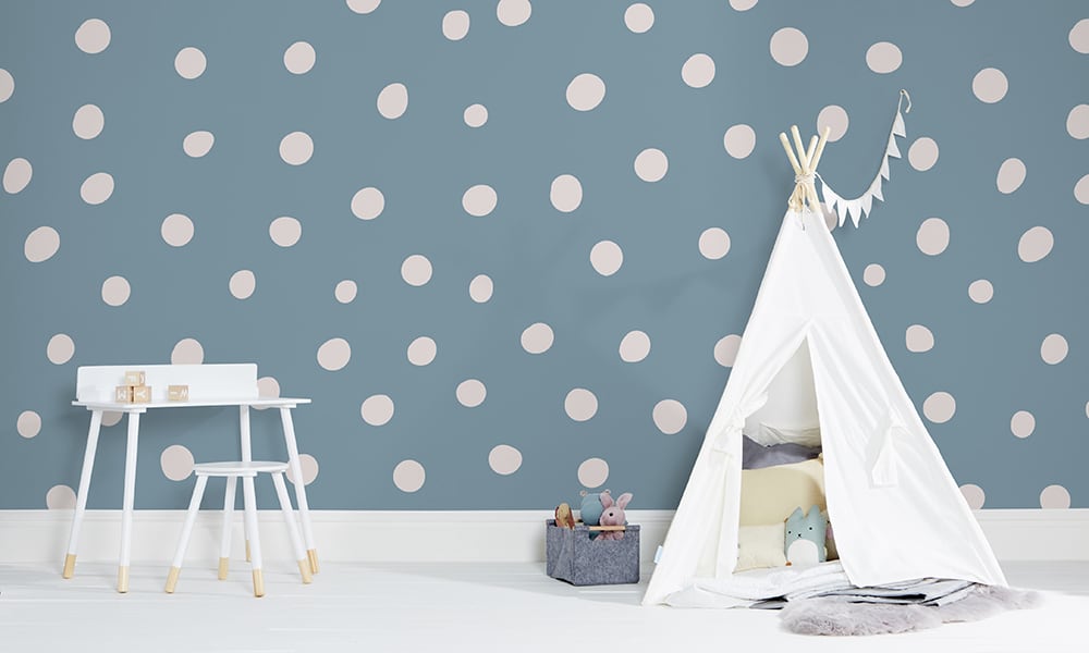 Blue polka dot wallpaper in a large size with a play tent