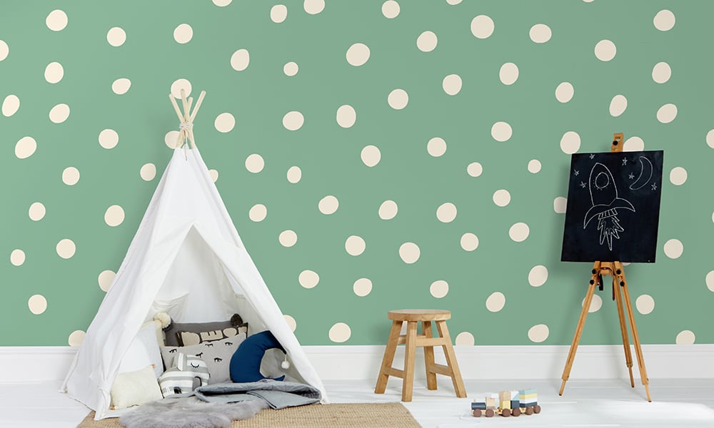 Green polka dot wallpaper in a large size with a play tent