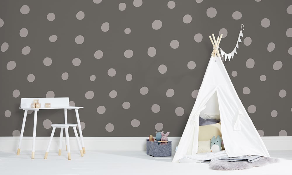 Grey polka dot wallpaper in a large size with a play tent