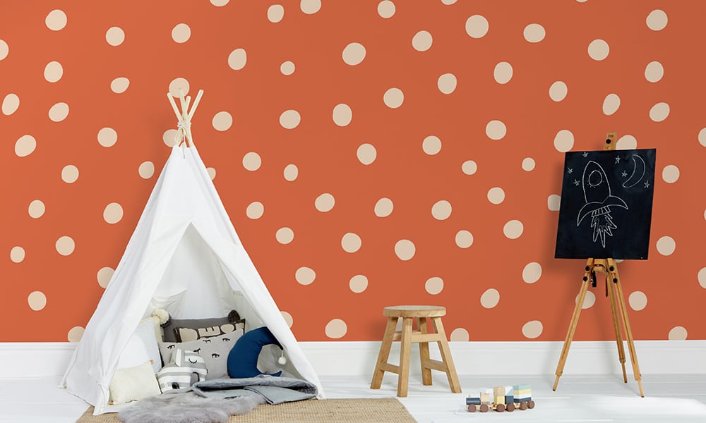 Orange polka dot wallpaper in a large size with a play tent