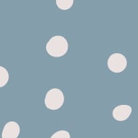 Inverted blue polka dot wallpaper situated in kids bedroom with a play tent