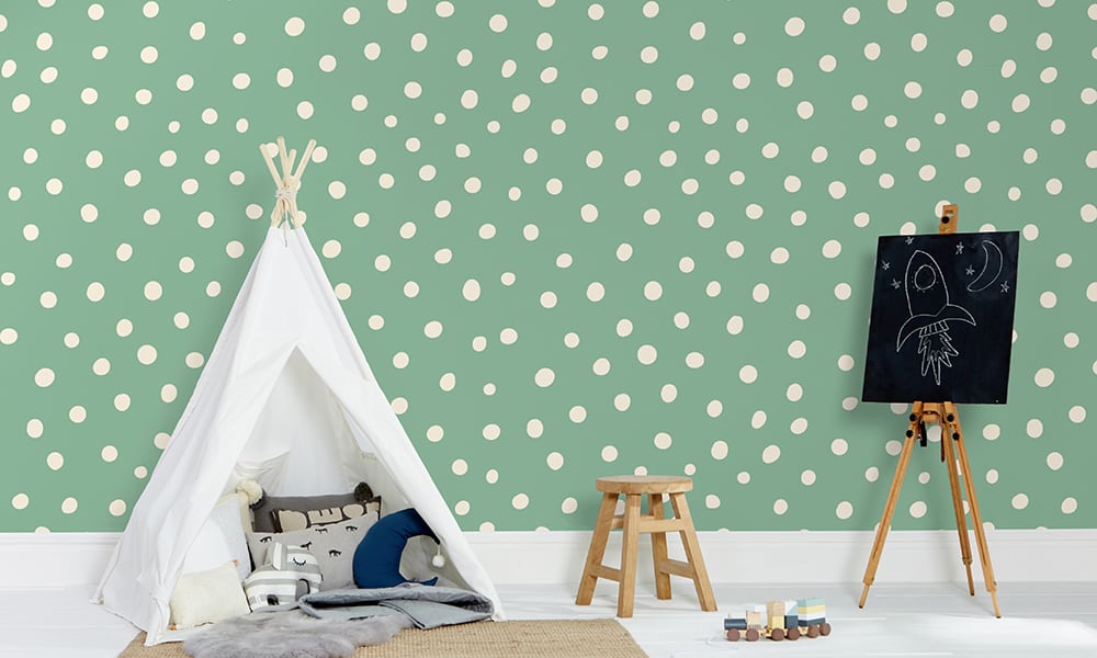 Green polka dot wallpaper in a medium size situated in kids bedroom