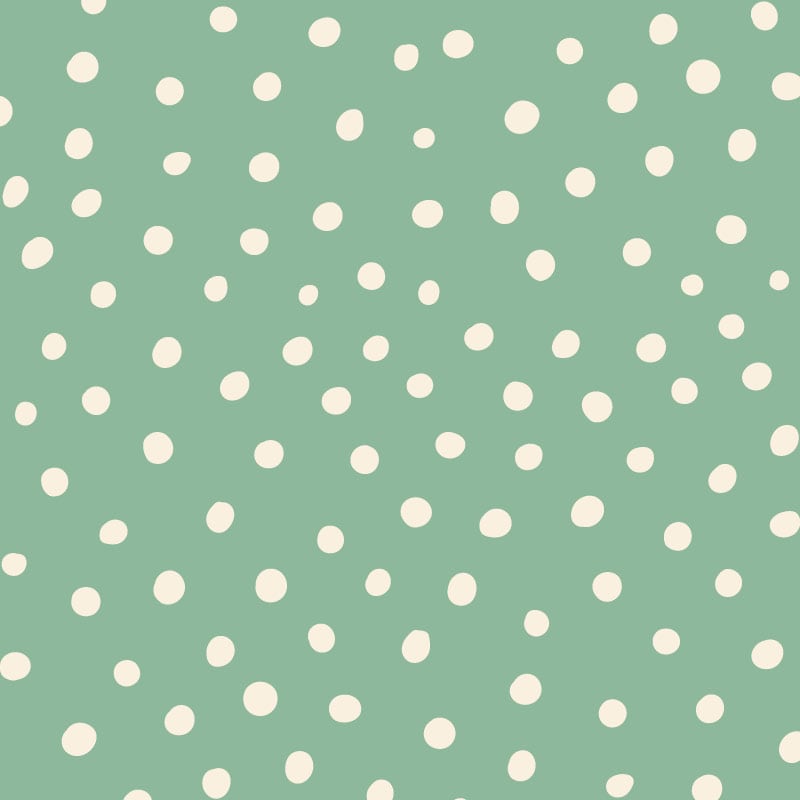 Inverted green polka dot wallpaper situated in kids bedroom with a play tent