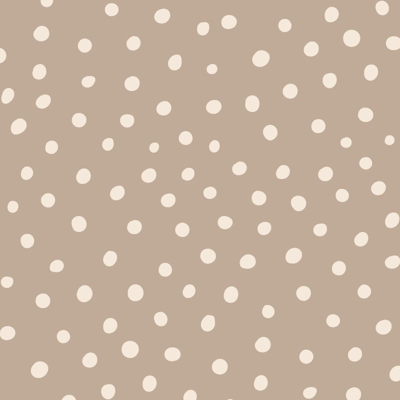Inverted neutral polka dot wallpaper situated in kids bedroom with a ladder