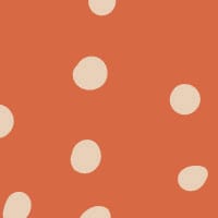 Inverted orange polka dot wallpaper situated in kids bedroom with a play tent