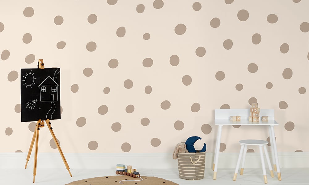 Neutral polka dot wallpaper in a large size with a ladder