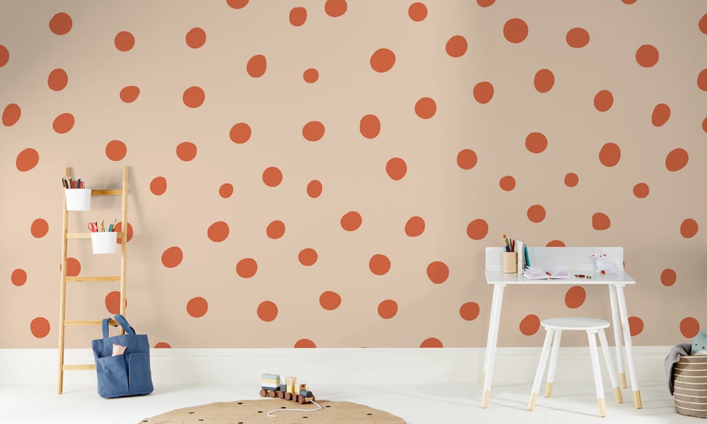 Orange polka dot wallpaper in a large size with a ladder