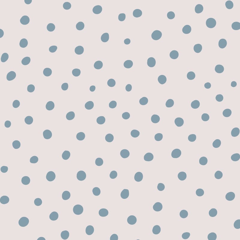 Blue polka dot wallpaper situated in kids bedroom with a ladder