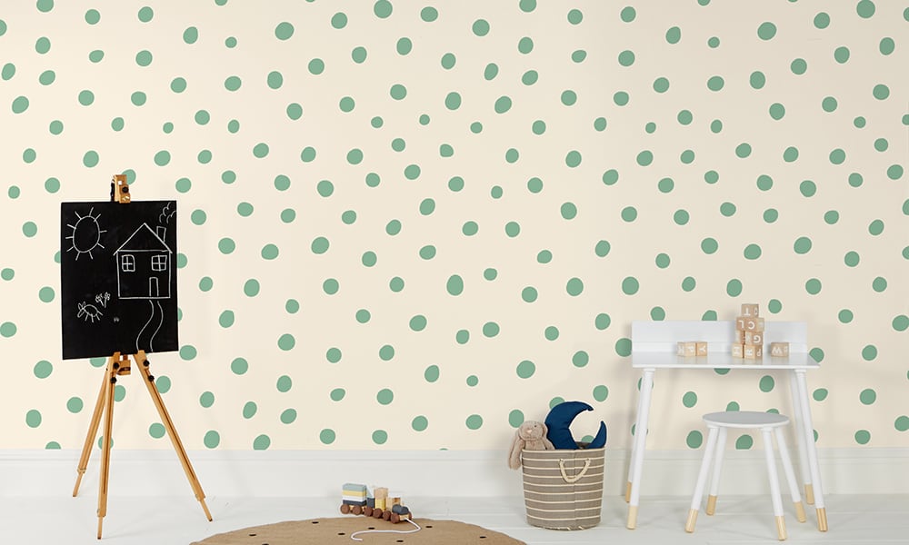 Green polka dot wallpaper in a medium size with a chalk board