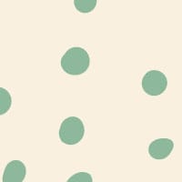Green polka dot wallpaper situated in kids bedroom with a chalk board