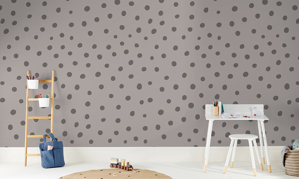 Grey toned polka dot wallpaper in a medium size situated in kids bedroom