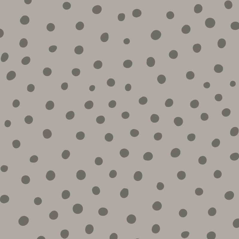 Grey polka dot wallpaper situated in kids bedroom with a ladder and desk