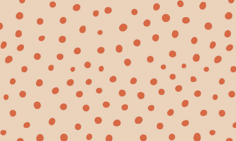 Red and orange toned polka dot wallpaper design