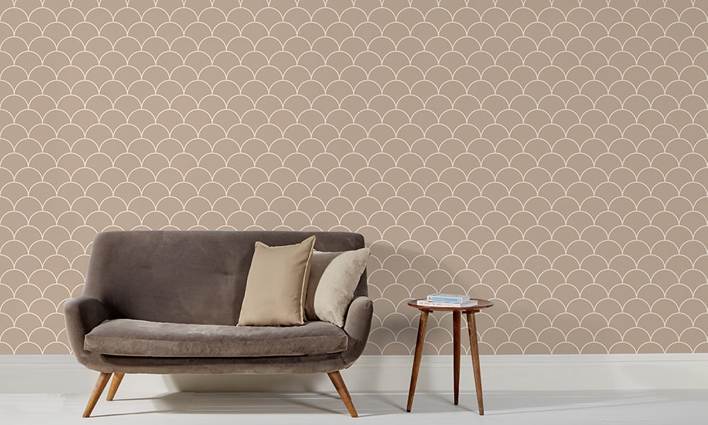 Scales wallpaper design in neutral and a medium size with grey sofa and side table