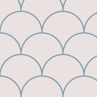 Blue scales wallpaper design situated in bedroom with grey cushions and book