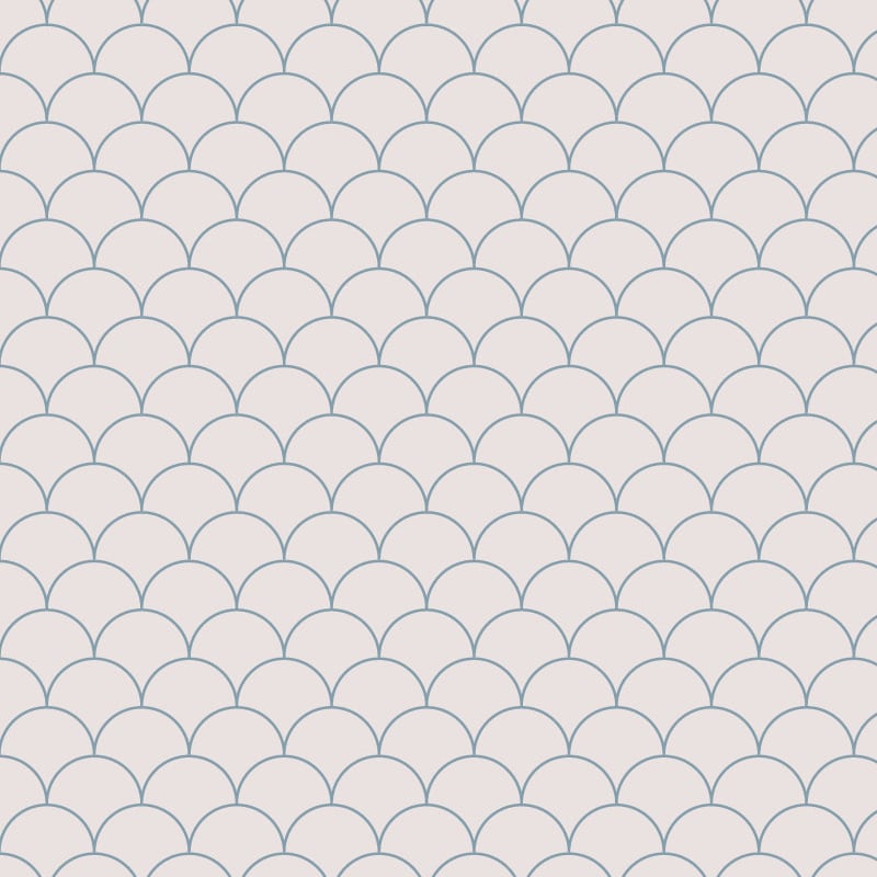 Blue scales wallpaper design situated in bedroom with grey cushions and book