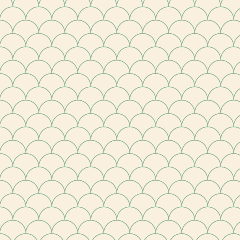 Scales green wallpaper design situated in bedroom with grey cushions and books
