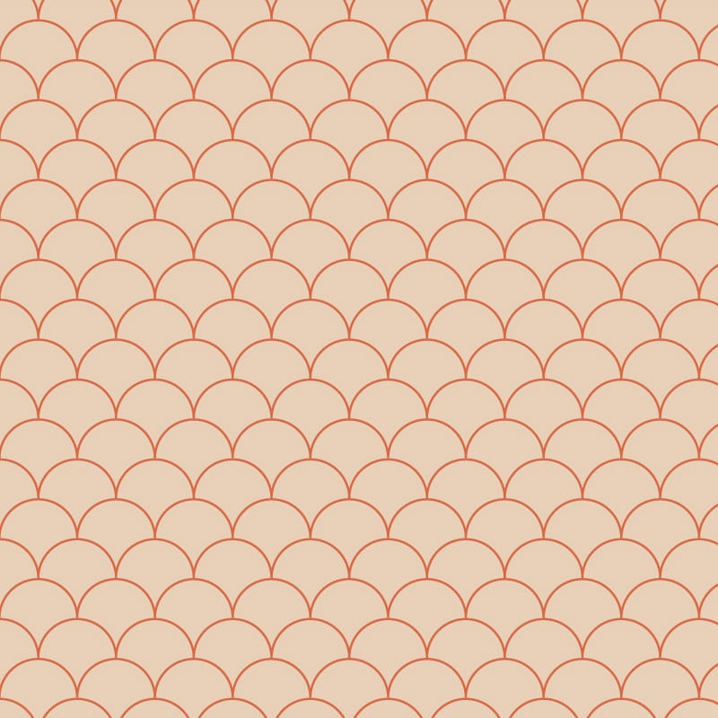 Scales orange wallpaper design situated in bedroom with grey cushions and books