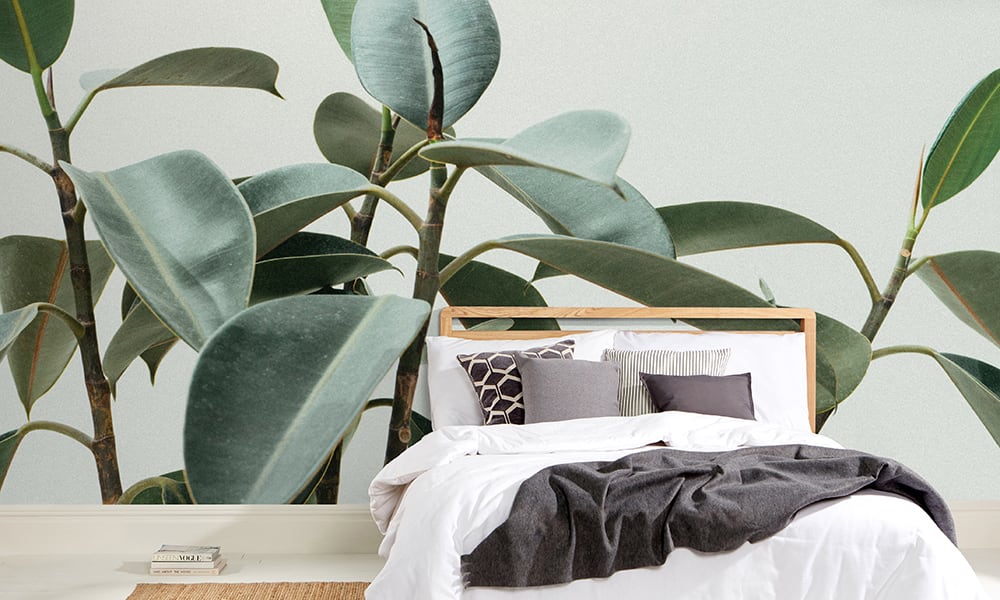 Green plant wall mural in a scandi stylist bedroom