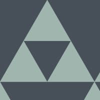 Sierpinski ocean coloured wallpaper in living room with grey chair